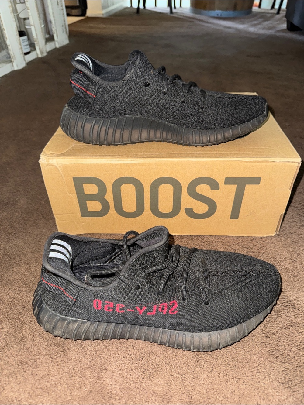 Men’s yezzy Black Athletic Sneakers with Red Accent - Trendy Comfort.. not real